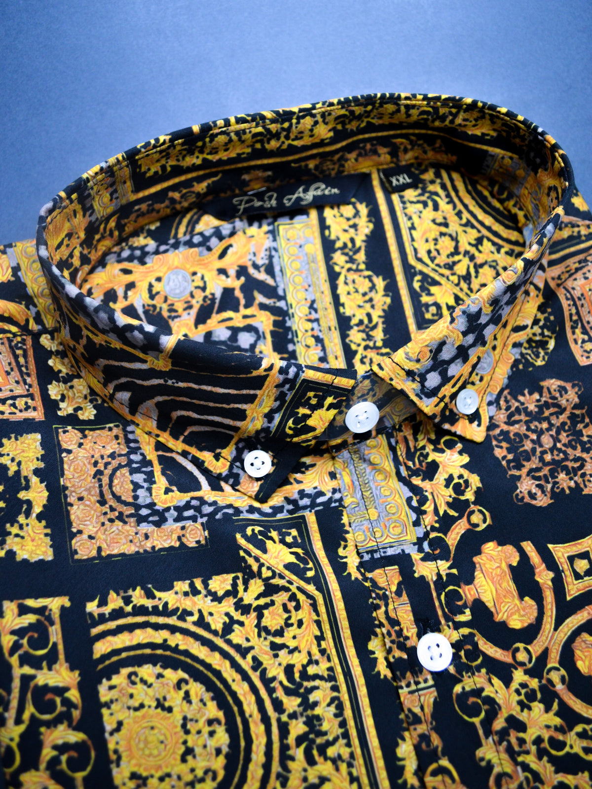Printed black shirt with gold paisley motif